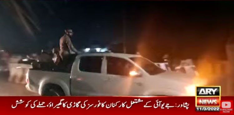 JUI-F workers surround security forces' vehicle in Peshawar