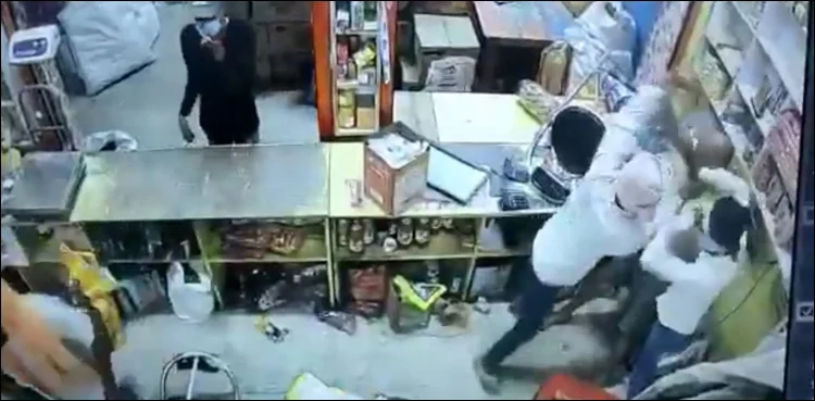 Brave shop owner confronts robbers; video goes viral