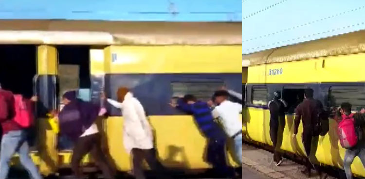 Watch: Passengers push train in viral video