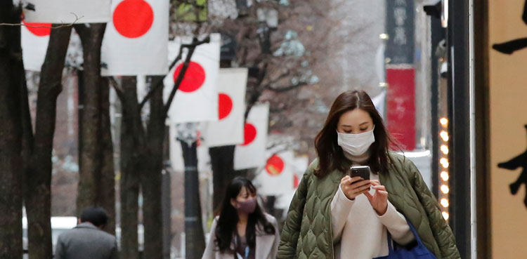Heavy snow in Japan disrupts flights and trains, closes roads