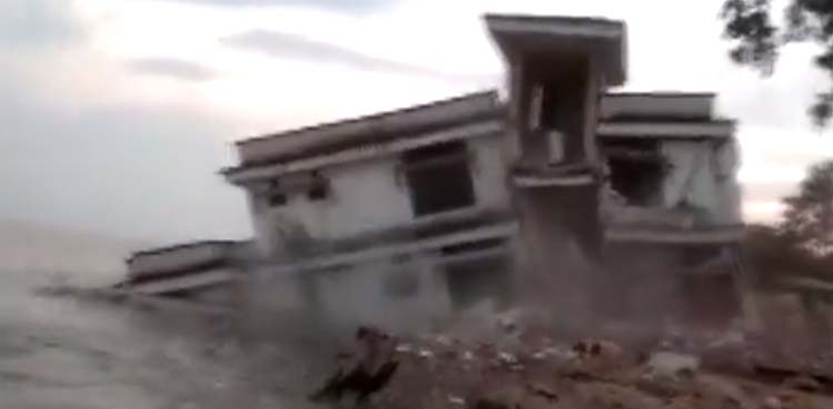 Viral Video shows police station being washed away by floods