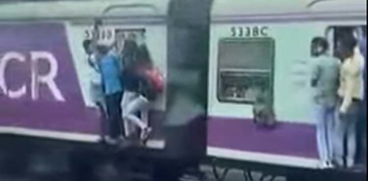 Video: Man falls off moving train after hitting pole