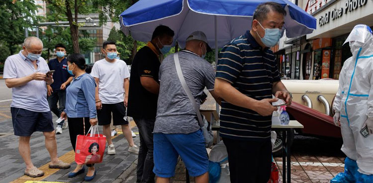 Beijing city mandates COVID vaccinations, relaxes curbs