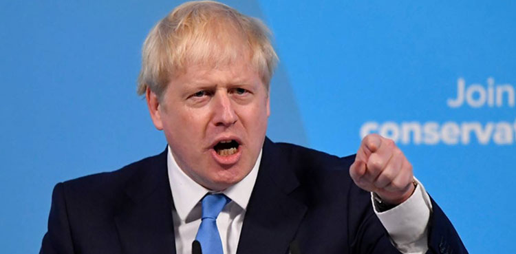 Boris Johnson digs in as ministers desert government