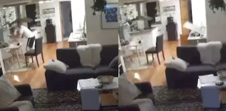 Father runs outside house with daughter just before earthquake