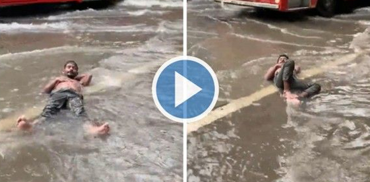 Man enjoys floodwater amid rains, video goes viral