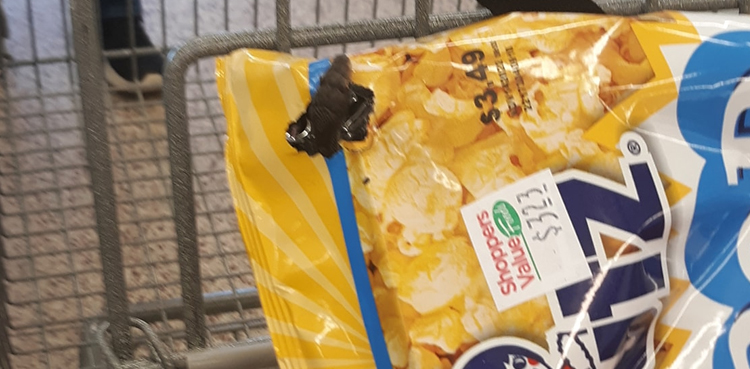Woman finds snake head popping out of popcorn bag