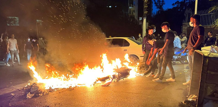 Protesters rally across Iran in third week of unrest over Amini's death