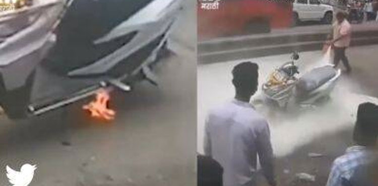 Watch: Passersby come to couple’s rescue after scooter catches fire