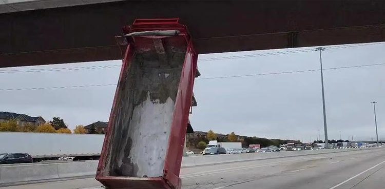 Canadian driver gets truck stuck under an overpass, vertically!