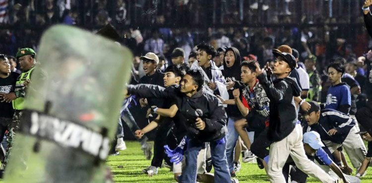 Indonesia's fatal soccer stampede caused by tear gas: report