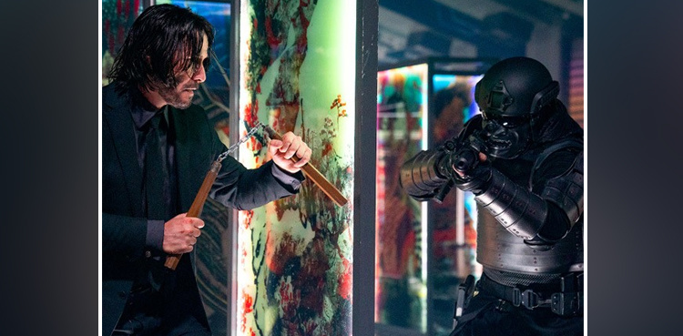 Keanu Reeves holds nunchucks in 'John Wick: Chapter 4' picture