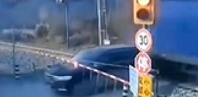 VIRAL: SUV driver narrowly escapes from getting hit by train