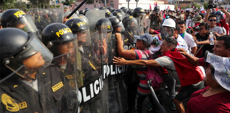 Thousands march on Peru's capital as unrest spreads, building set ablaze