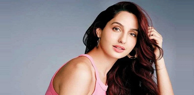 Nora Fatehi tells paparazzi 'sambhal ke giro'; gets trolled