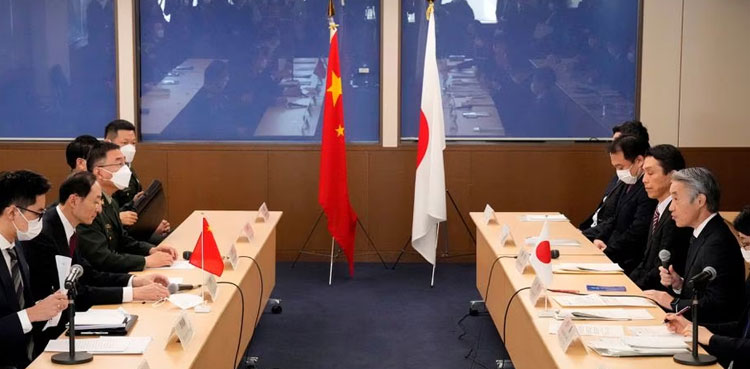 China tells Japan it is troubled by Tokyo's military build up