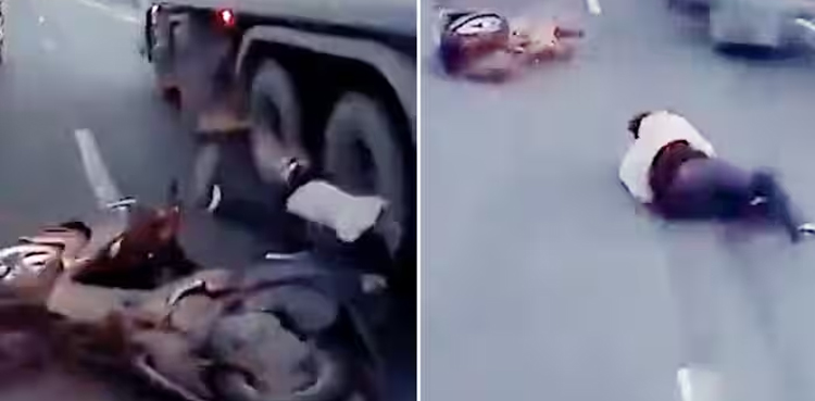 Video: Biker nearly gets crushed between two trailers