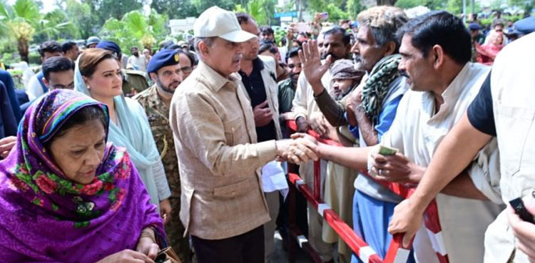 PM Shehbaz visits free flour distribution centers, reviews process