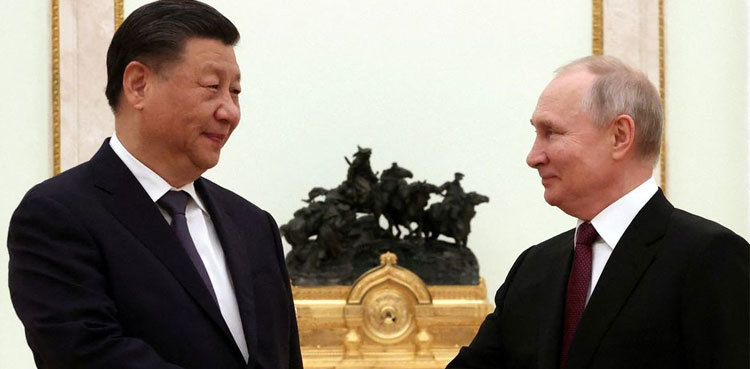 Putin in China to meet 'dear friend' Xi