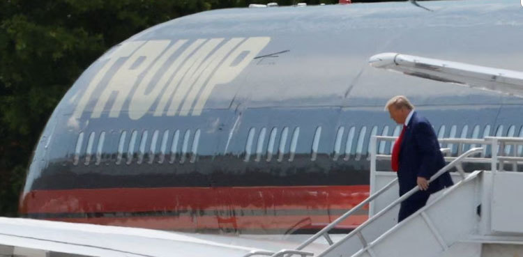 Donald Trump arrives in Florida to face charges