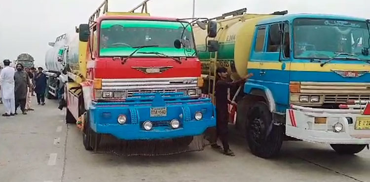 Transporters stage protest at National Highway against vehicles burning