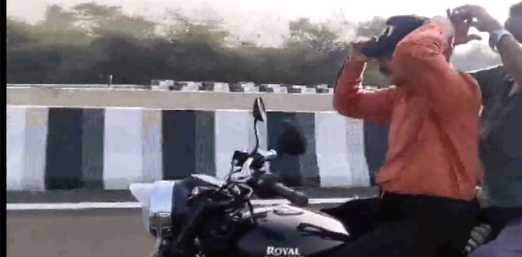 Watch: Politician rides bike without helmet, performs stunts