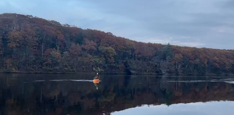 Massachusetts man paddles giant pumpkin boat to break world record