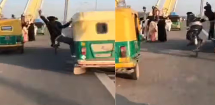 Viral video: Man hits cyclist while performing stunt in moving auto