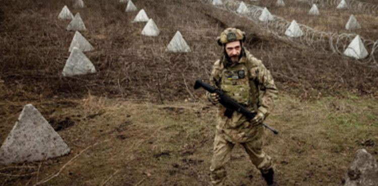 Ukraine builds barricades, digs trenches as focus shifts to defence