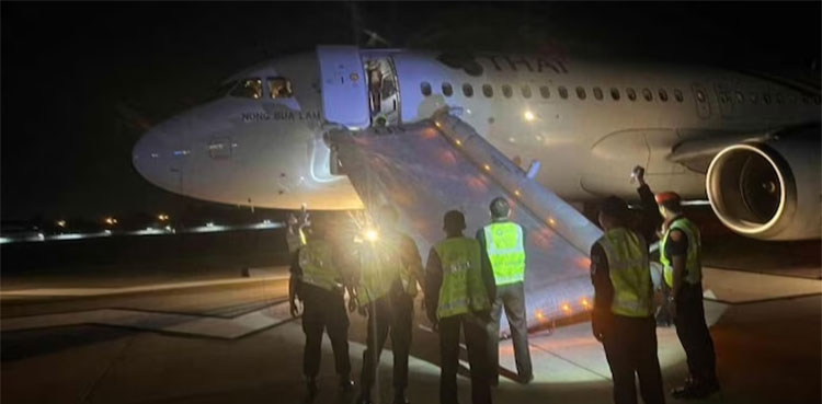 Man opens Thai Airways plane door before takeoff
