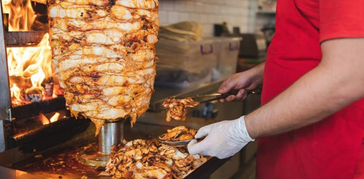 Dead chicken meat being used in Shawarma