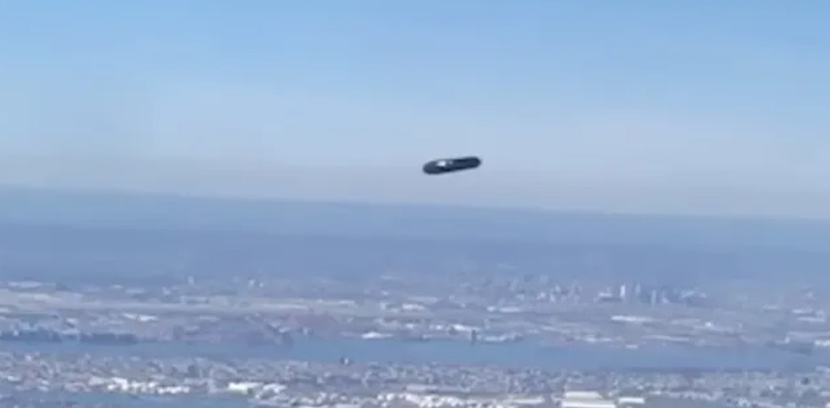 WATCH: Plane passenger spots ‘flying cylinder UFO’ out her window