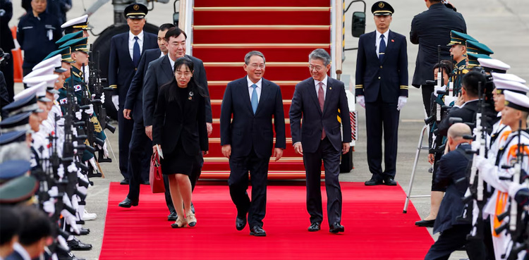 China's premier hails 'new beginning' with US-allied South Korea, Japan