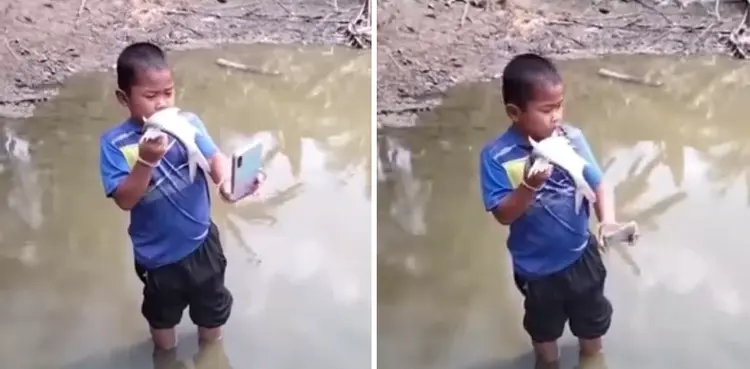 VIRAL: Boy clicks selfie with fish, throws phone in water