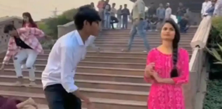 WATCH: Woman falls down stairs as couple continues shooting reel