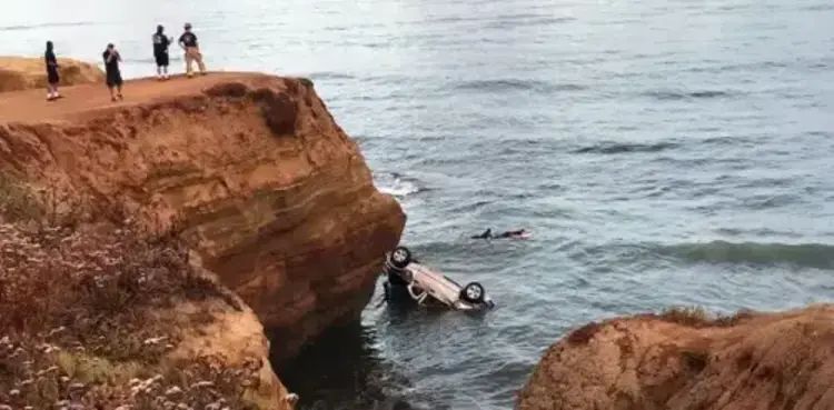 Man drives car off a cliff to kill twin daughters