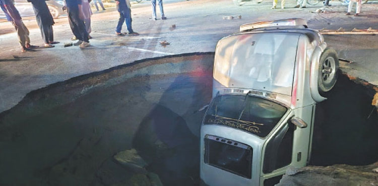 WATCH: Huge sinkhole swallows three vehicles in Lahore