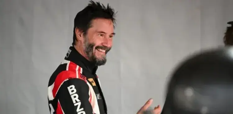 Keanu Reeves escapes collision in pro auto racing debut