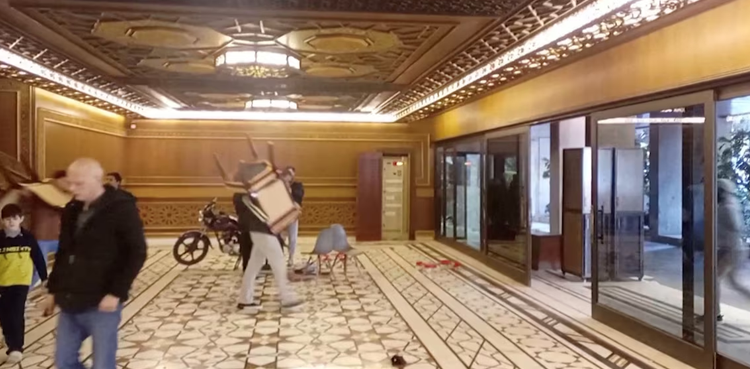Syrians stroll through Assad's palaces, take furniture and ornaments