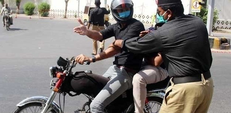 At least 15 detained for violating ban on pillion riding in Karachi