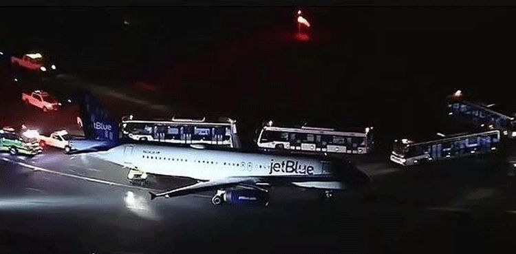 Passenger opens emergency door of plane to jump out