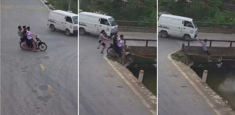 Pillion rider leaps to safety as motorcycle plunges off bridge into drain