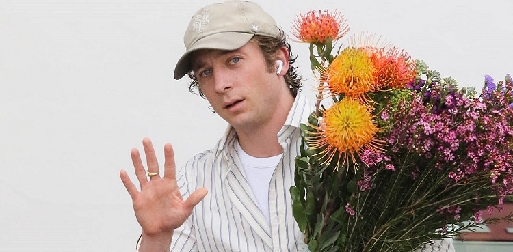 Why Jeremy Allen White is always seen with huge flower bouquets?