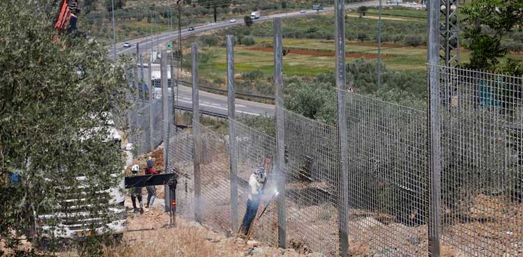 West Bank town becomes 'big prison' as Israel fences it in