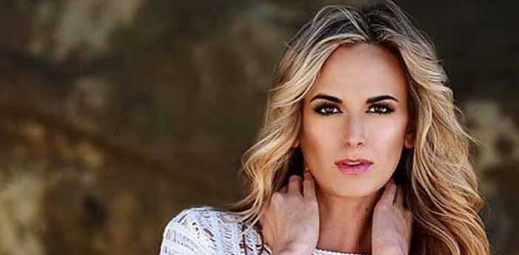 Jena Sims poses with Lewis Hamilton's $450 million car at U.S. Grand Prix