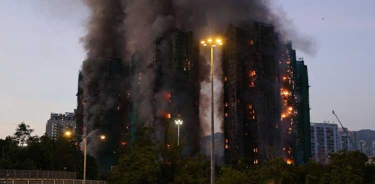 Hong Kong fire: At least 14 dead as blaze engulfs apartment buildings