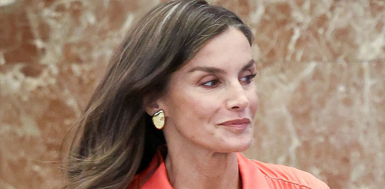 Queen Letizia stuns in burgundy pantsuit during solo outing in China