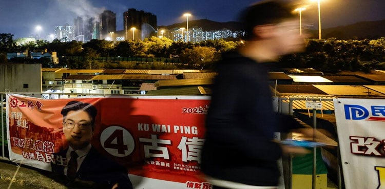 Hong Kong faces low election turnout as residents mourn deadly fire