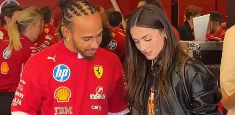 Lewis Hamilton brings out his smile during garage tour at Abu Dhabi Grand Prix