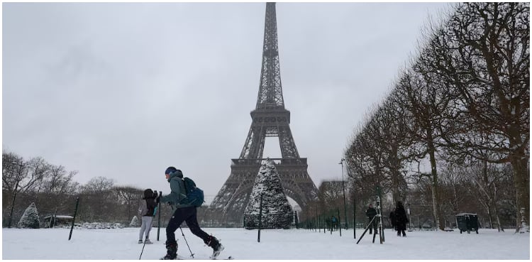Snowstorm sees travellers bed down in Amsterdam airport, Parisians take to skis